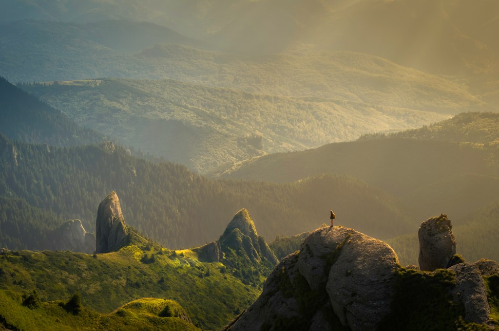 person-standing-on-mountain